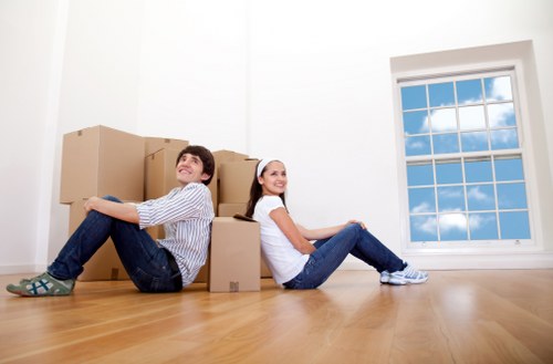 Professional movers handling boxes in South Kensington